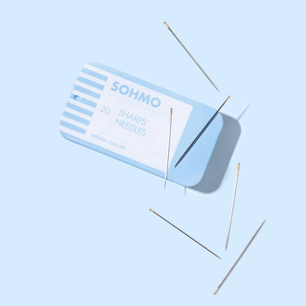 SOHMO sharps needles on a light blue background