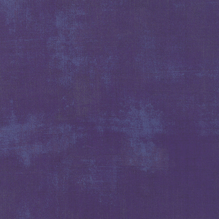 Grunge dark purple color swatch with a textured pattern
