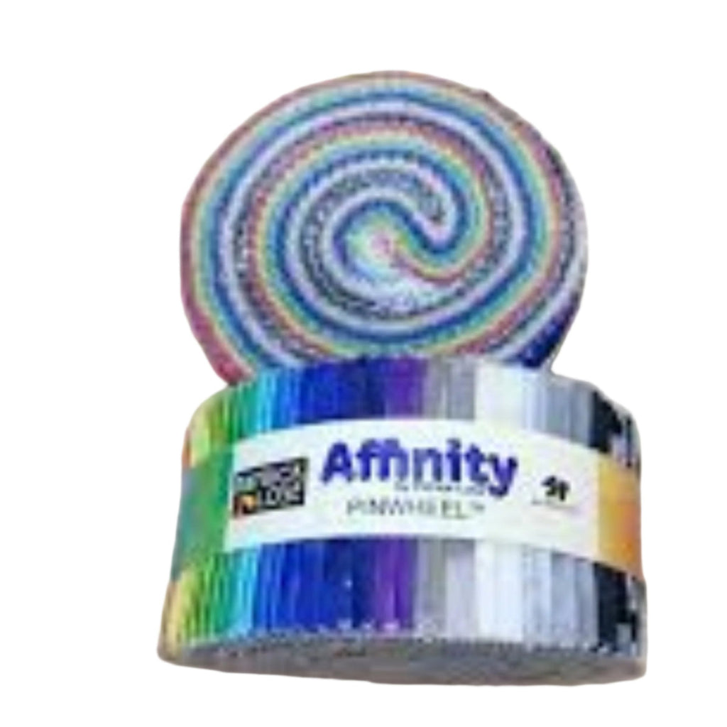A colorful striped Patrick Lose Affinity Pinwheel, resembling a jelly roll, with a label in the center displaying the brand and product name.