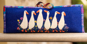 Rectangular pouch with geese design on a blue background