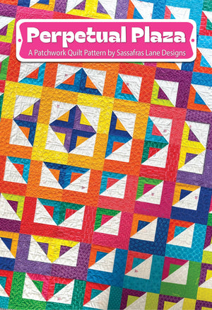 Colorful patchwork quilt pattern with 'Perpetual Plaza' text and Sassafras Lane Designs logo.