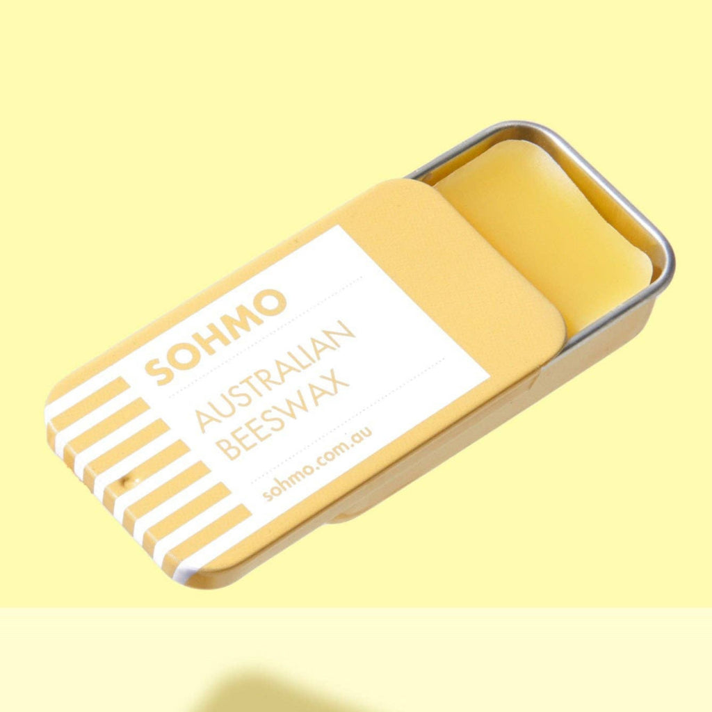 SOHMO Australian Beeswax product in a tin on a yellow background