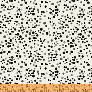 A fabric with a kaleidoscope pattern of black and white dots.