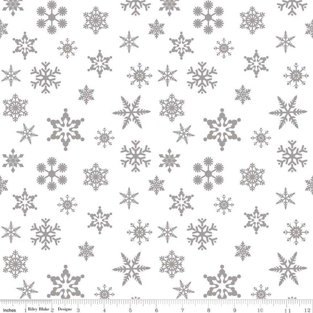 A fabric with a silver metallic snowflake pattern.