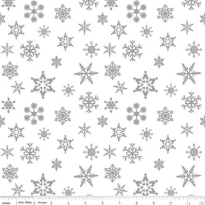 A fabric with a silver metallic snowflake pattern.