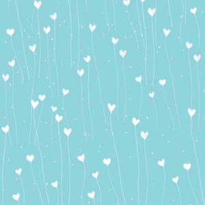 A fabric featuring a pattern of white hearts on a teal blue background.