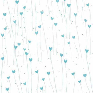 A fabric with a pattern of white and teal hearts and dots.