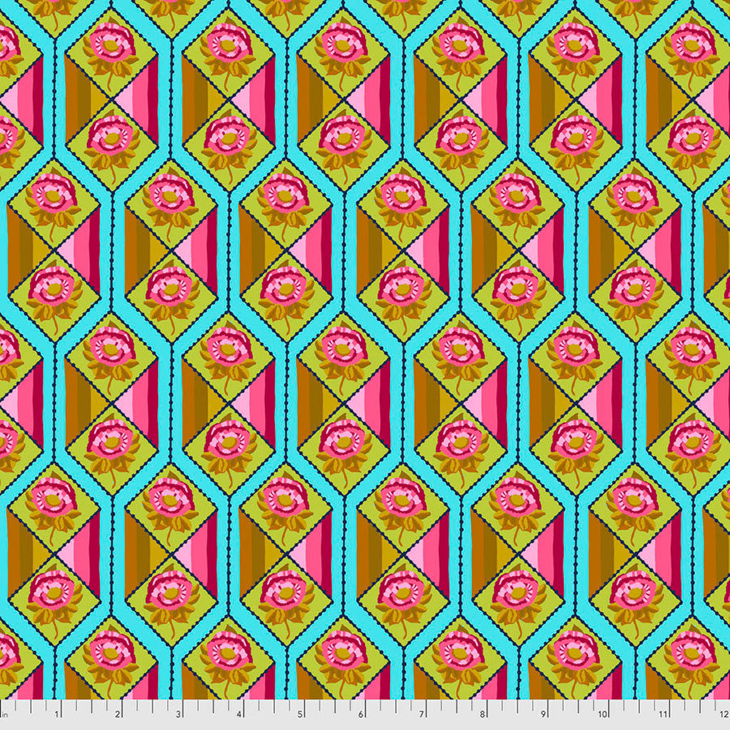 A patterned fabric featuring a geometric and floral design with shades of pink, yellow, green, and blue.