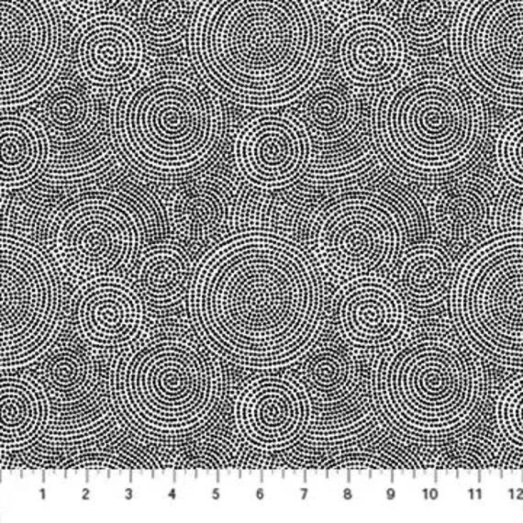 A fabric with a geometric circular mosaic dot pattern in white and black.