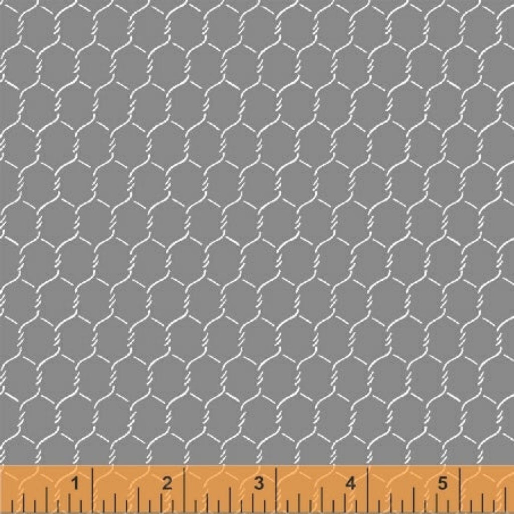 A textured grey fabric with a chicken wire pattern, marked with a tape measure for scale.