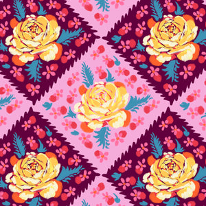 A piece of fabric featuring a floral pattern with prominent yellow roses on a pink background, part of the Fluent collection.