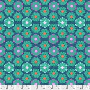 A fabric featuring a geometric honeycomb pattern with denim blue background and multicolor flowers.