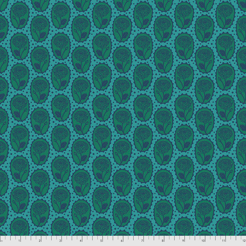 A fabric with a geometric pattern featuring a repeating design of interconnected circles in shades of blue and green.