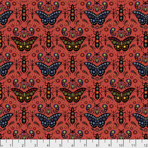 A pink fabric with a repeated pattern of butterflies and floral designs on a red background.