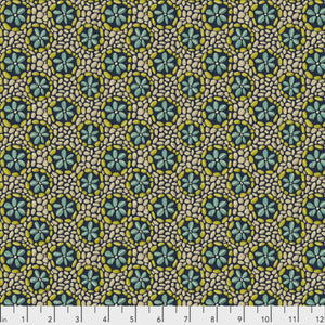 A fabric featuring a geometric pattern with floral and abstract elements in navy blue and cream colors.