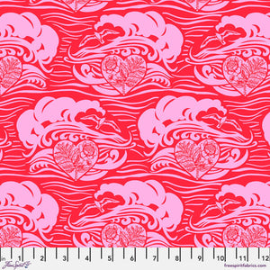 A piece of fabric featuring a pattern with abstract representations of a cityscape in pink on a red background, with a measuring scale along the bottom edge.