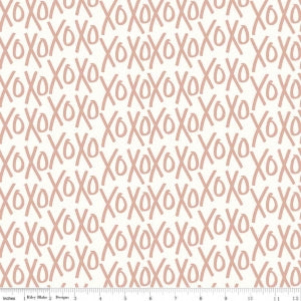 A fabric with a cream color and a metallic gold (XO'S) pattern, sent as a single piece, cannot be cut into smaller sizes.