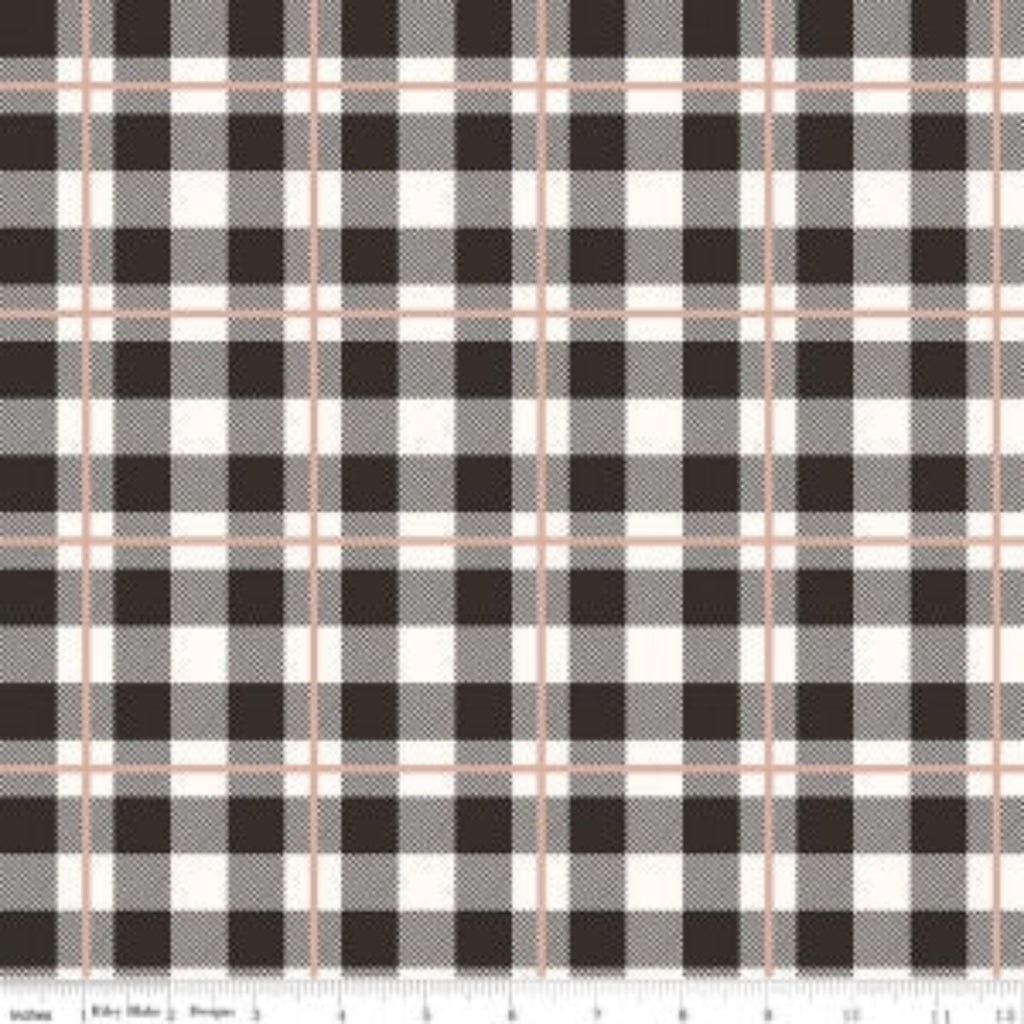 A piece of fabric with a checkered pattern in black, cream, and rose gold colors, indicating a metallic finish.